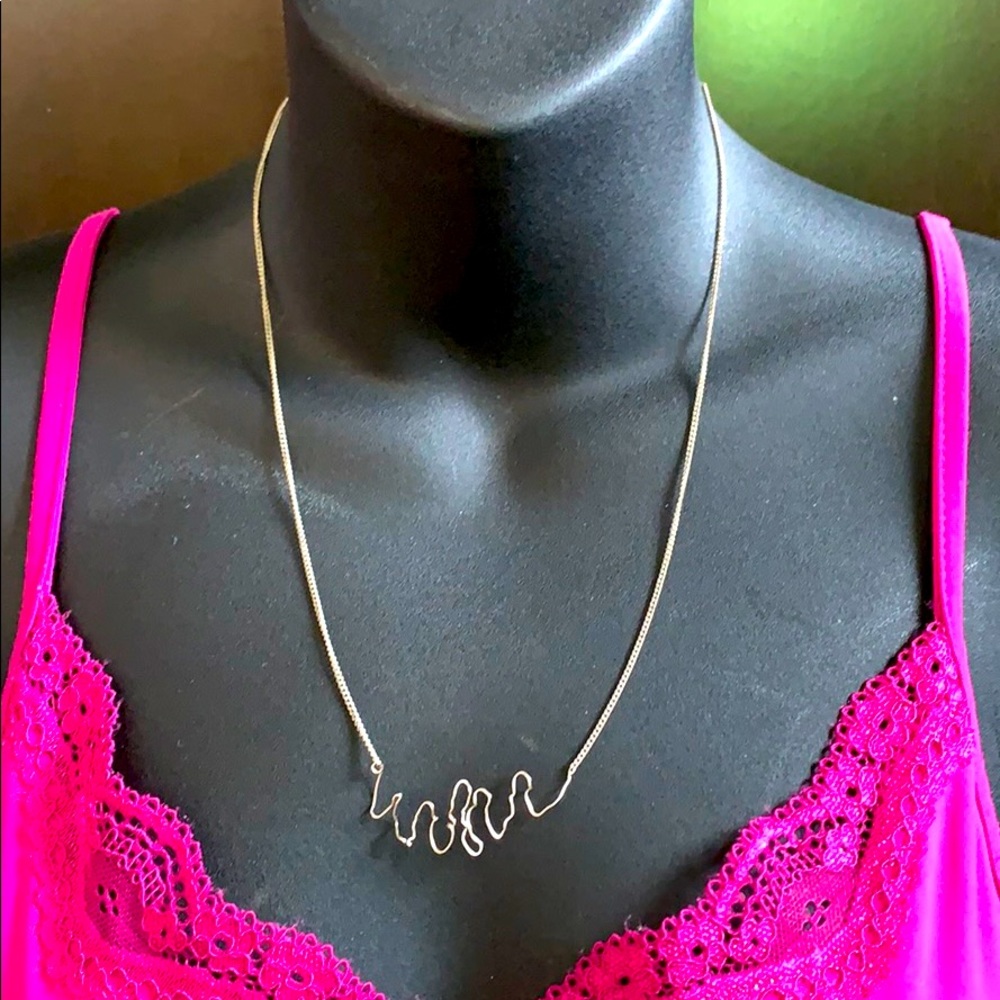 Long chain adjusted middle silver tone necklace